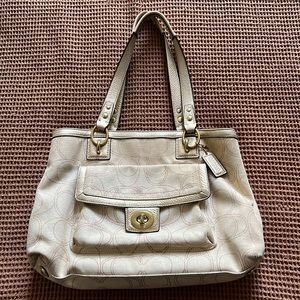 Lightly used Coach bag with shoulder straps and inner pocket.